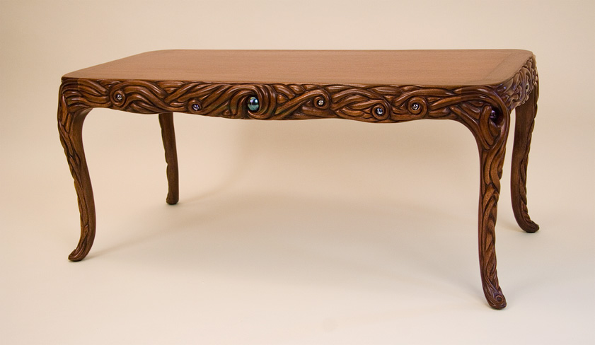 Carved and inlaid mahogany table
