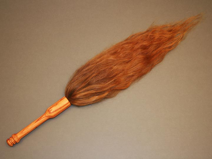 Ritual Object, a flogger made with human hair and tulipwood