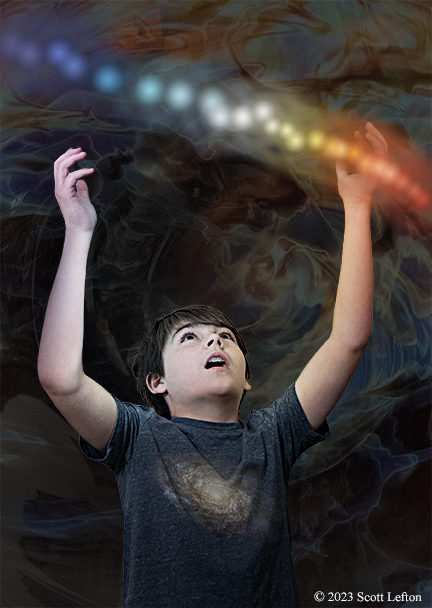 A young boy reaches up towards a string of glowing lights representing types of stars.