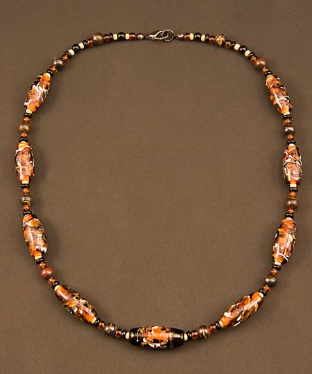 Necklace made with tiger-colored lampworked glass beads