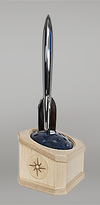 Image of the 2026 Hugo Trophy - A silver rocket on top of a blue-black moon, with the moon embedded in a squarish maple wooden base